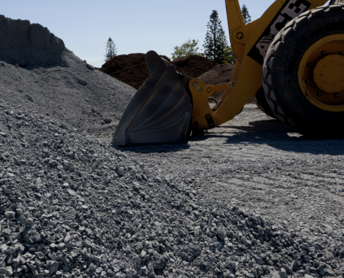 Loader bucket with landscaping material